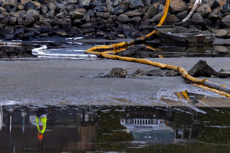 FILE PHOTO: California oil spill comes ashore in Huntington Beach