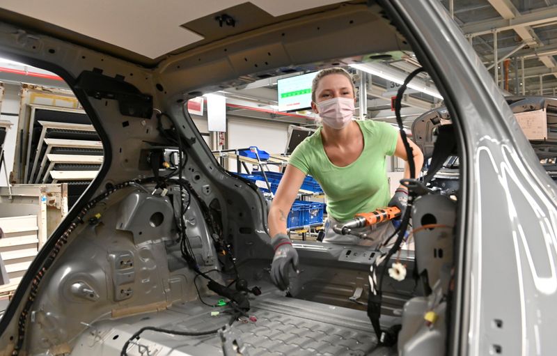 FILE PHOTO: A technician works at the assembly line of Volkswagen's electric ID.3 car in Zwickau