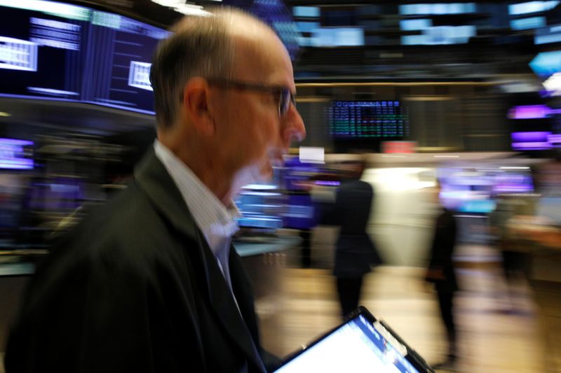 Traders work on the floor of the NYSE in New York