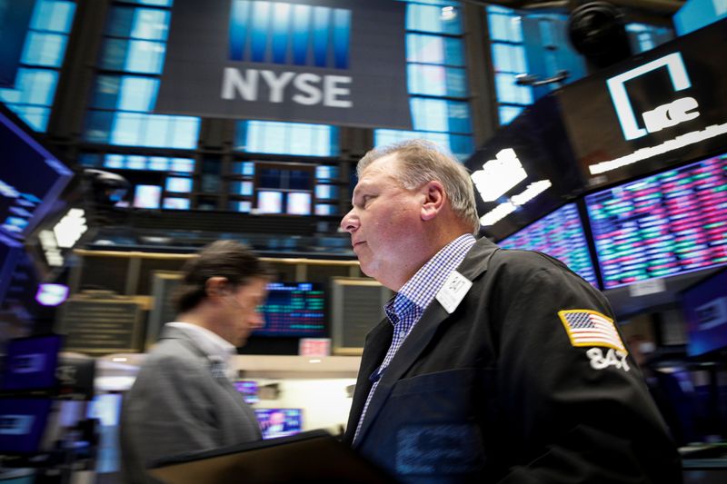 Traders work on the floor of the NYSE in New York