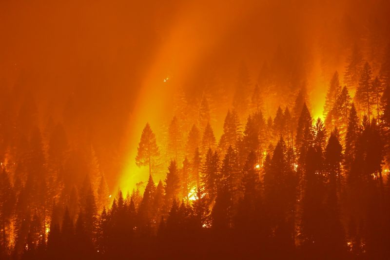 FILE PHOTO: California's Dixie Fire burns at night in Taylorsville