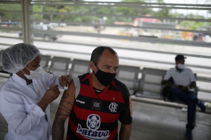 FILE PHOTO: Vaccination against the coronavirus disease (COVID-19) at Bus Rapid Transit (BRT) station in Rio de Janeiro
