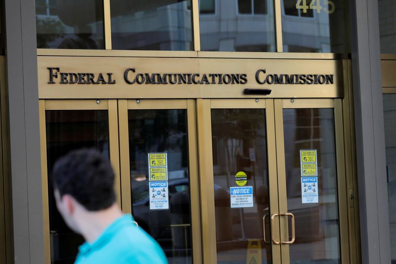 FILE PHOTO: Signage is seen at the headquarters of the Federal Communications Commission in Washington, D.C.