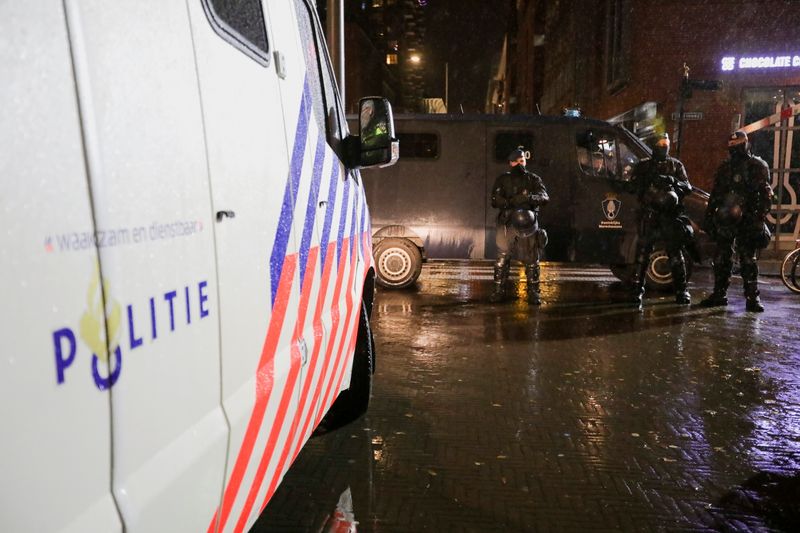 Police guard the streets following Dutch PM Rutte's announcement of new measures to fight a record surge in COVID-19 infections, in The Hague