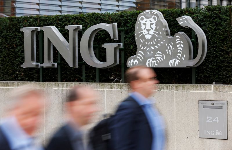 FILE PHOTO: Pedestrians walk past the logo of ING bank by the group's main office in Brussels