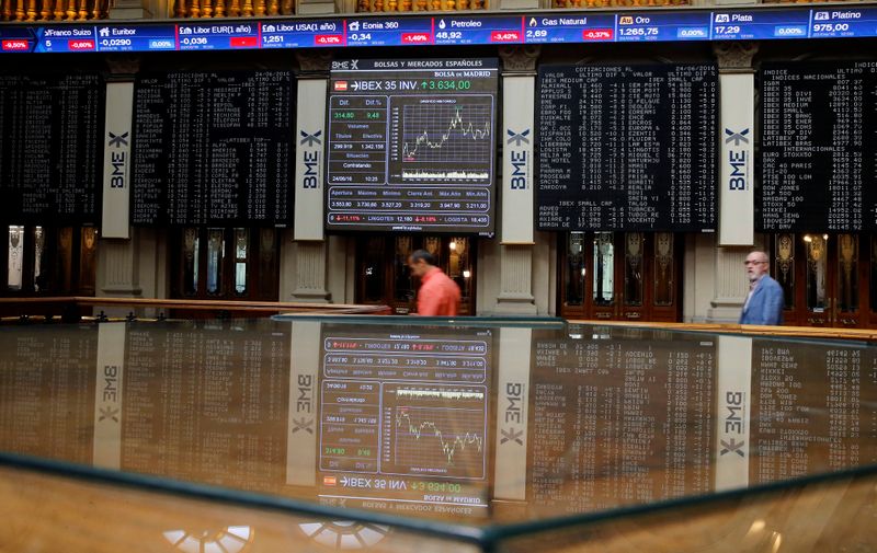 FILE PHOTO: Electronic boards are seen at Madrid stock exchange which plummeted after Britain voted to leave European Union in EU BREXIT referendum, in Madrid