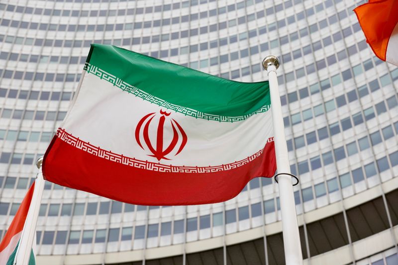 FILE PHOTO: FILE PHOTO: The Iranian flag waves in front of the International Atomic Energy Agency (IAEA) headquarters in Vienna