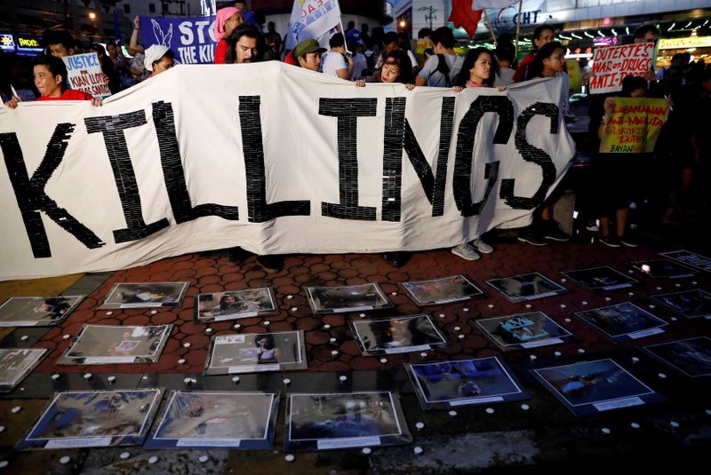 FILE PHOTO: Activists take part in a rally protesting at an escalation of President Rodrigo Duterte's war on drugs, in Quezon City, Metro Manila