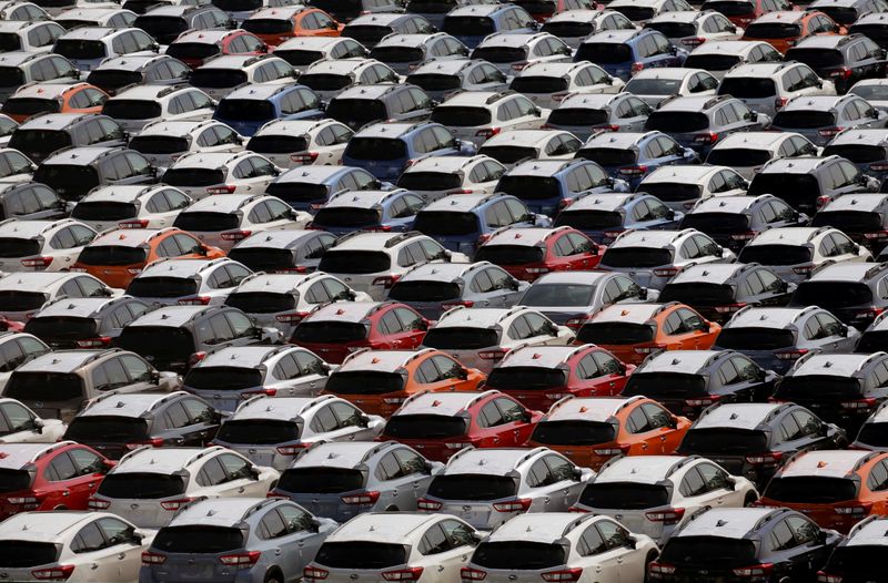 Newly manufactured cars of the automobile maker Subaru await export in a port in Yokohama