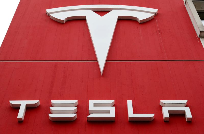 FILE PHOTO: FILE PHOTO: The logo of car manufacturer Tesla is seen in Bern