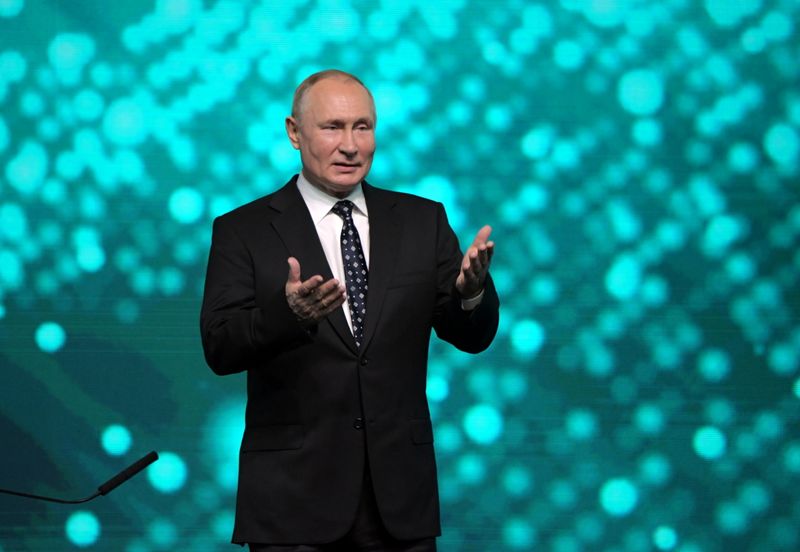 Russian President Vladimir Putin takes part in a conference in Moscow