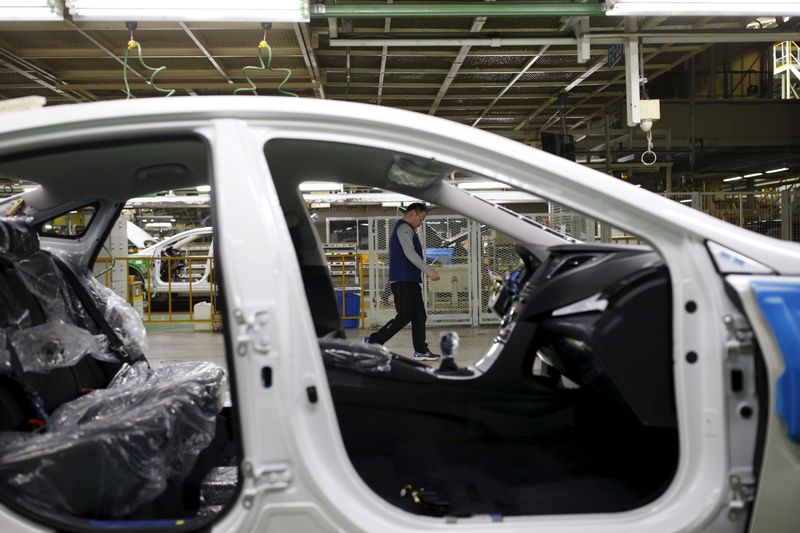 FILE PHOTO: A worker walks past an assembly line of Hyundai Motor's plant in Asan