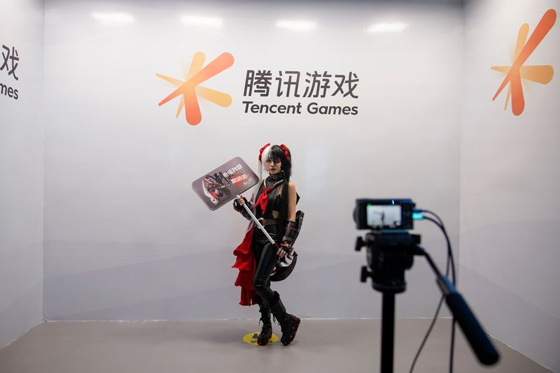 FILE PHOTO: A cosplay fan poses for a photo at a Tencent Games booth during the China Digital Entertainment Expo and Conference, also known as ChinaJoy, in Shanghai