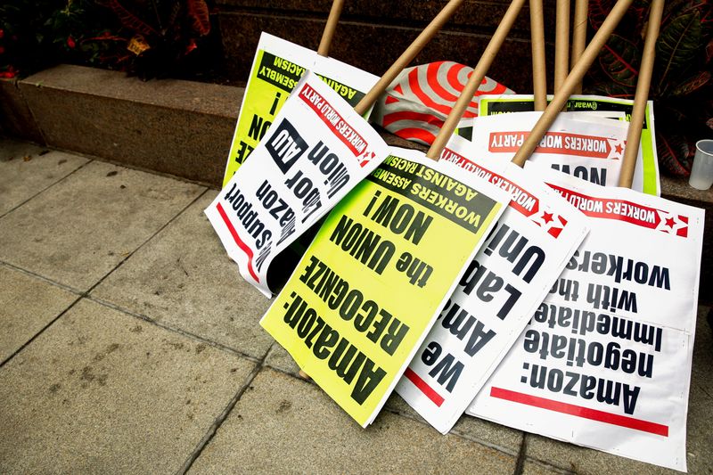 FILE PHOTO: Signs are stacked for Amazon workers before they arrive to file paperwork to unionize at the NLRB office in Brooklyn, New York