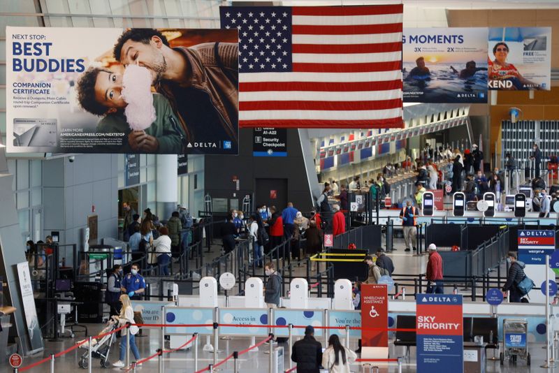 FILE PHOTO: Passengers travel through Logan Airport in Boston