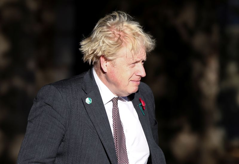 British Prime Minister Boris Johnson leaves an art exhibition on The Mall in London