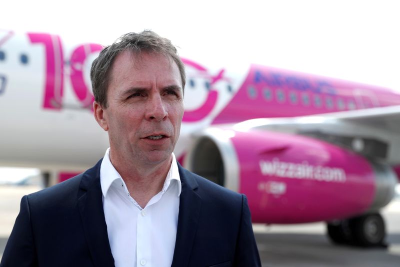 FILE PHOTO: CEO of Wizz Air, Jozsef Varadi, speaks during the unveiling ceremony for the airline's 100th plane