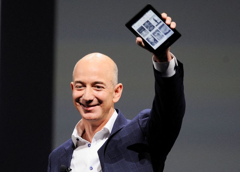 FILE PHOTO: Amazon CEO Jeff Bezos holds up a Kindle Paperwhite during Amazon's Kindle Fire event in Santa Monica, California