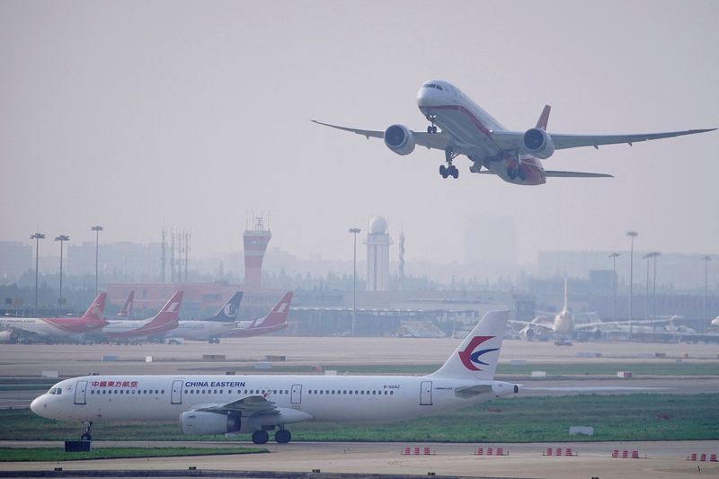 A China Eastern Airlines aircraft and Shanghai Airlines aircraft are seen in Hongqiao International Airport in Shanghai