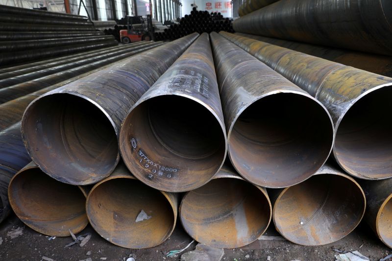 FILE PHOTO: Steel pipes are seen stacked at an industrial park in Shenyang