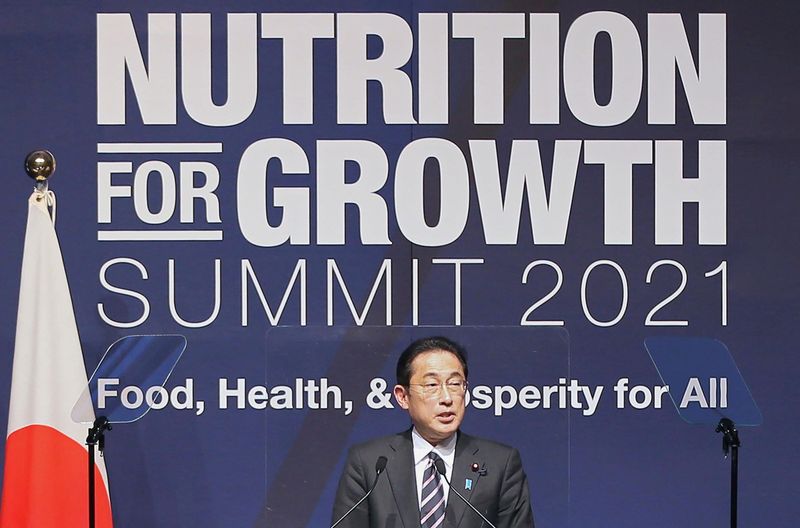 FILE PHOTO: Japan's Prime Minister Fumio Kishida delivers a speech at the Tokyo Nutrition for Growth Summit in Tokyo