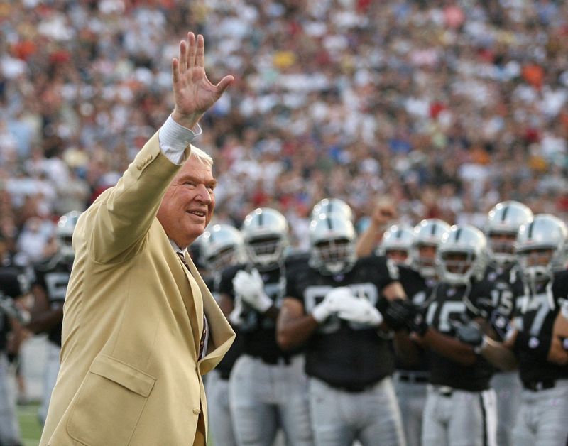 FILE PHOTO: Former Oakland Raiders' coach John Madden waves to the crowd before the Hall of Fame game in Canton, Ohio