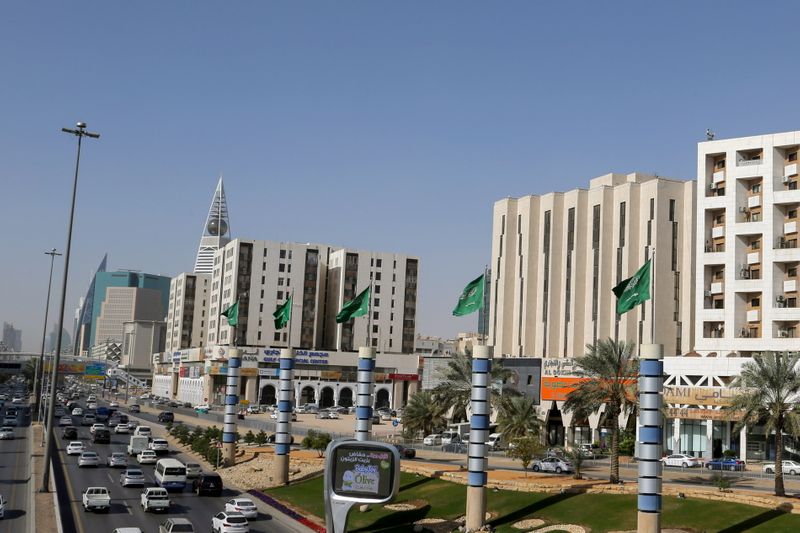 A view shows vehicles driving on a street in Riyadh