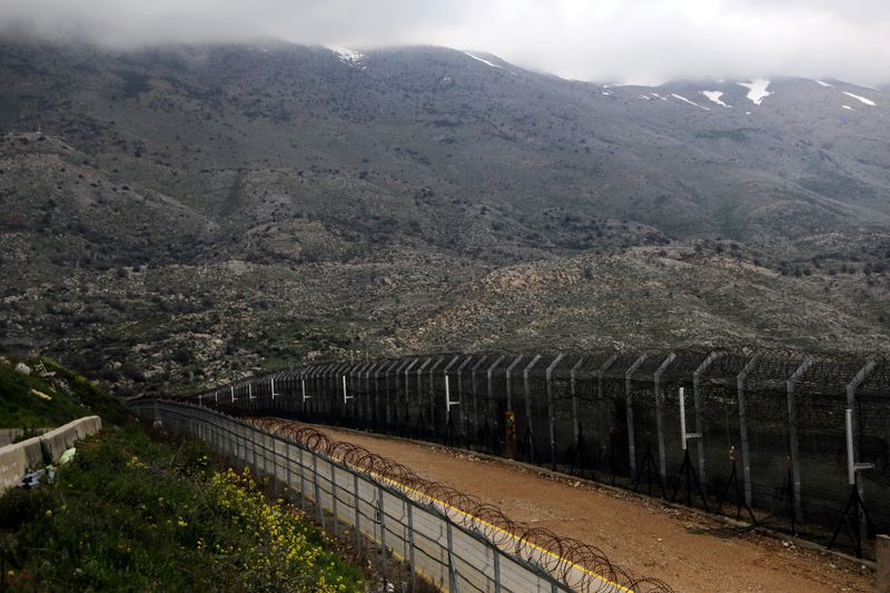 FILE PHOTO: Fences are seen on the ceasefire line between Israel and Syria in the Israeli-occupied Golan Heights