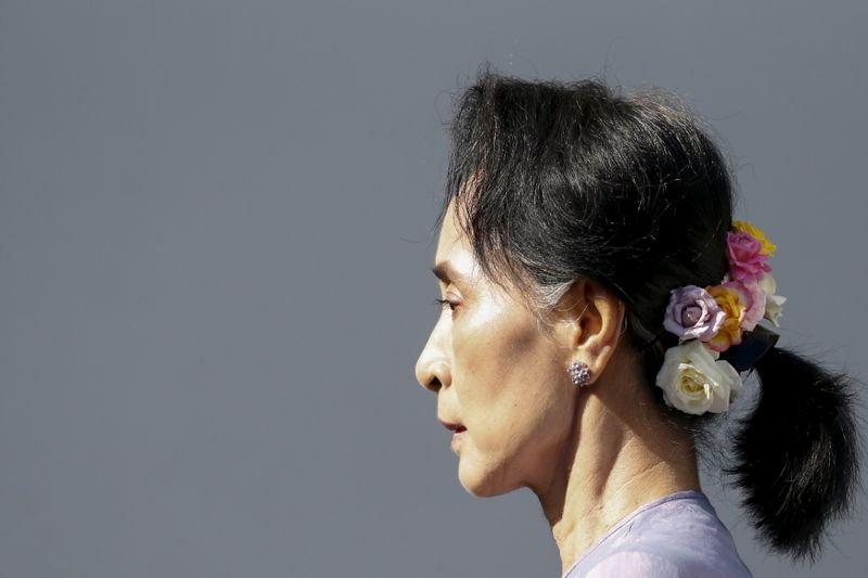 FILE PHOTO: Myanmar's National League for Democracy Party leader Aung San Suu Kyi arrives at a news conference at her home in Yangon