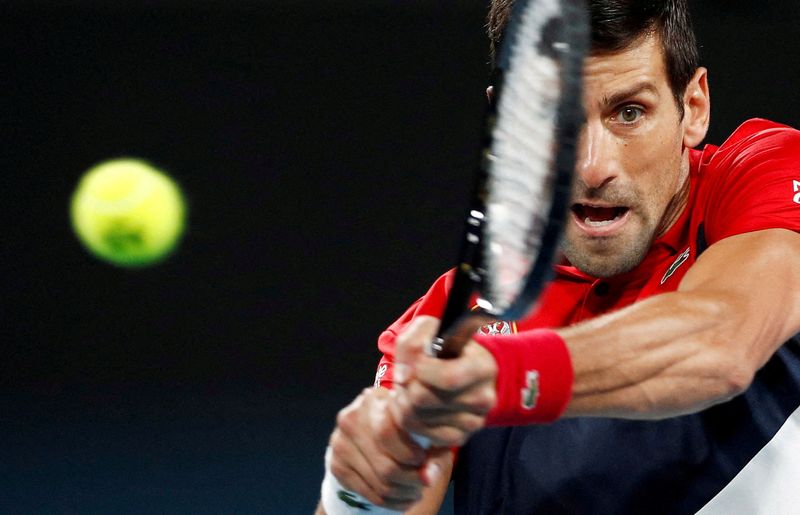 FILE PHOTO: World number one Novak Djokovic in action during a match against Spain's Rafael Nadal