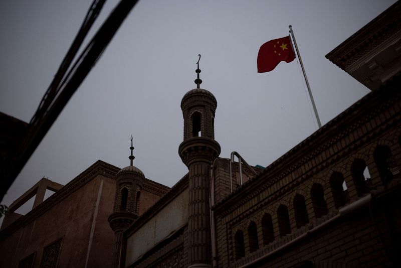 FILE PHOTO: The Wider Image: In China's new Xinjiang: patriotic tourism, police and propaganda