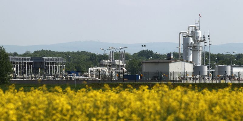 Austria's largest natural gas import and distribution station is pictured behind a field of rapeseed in Baumgarten
