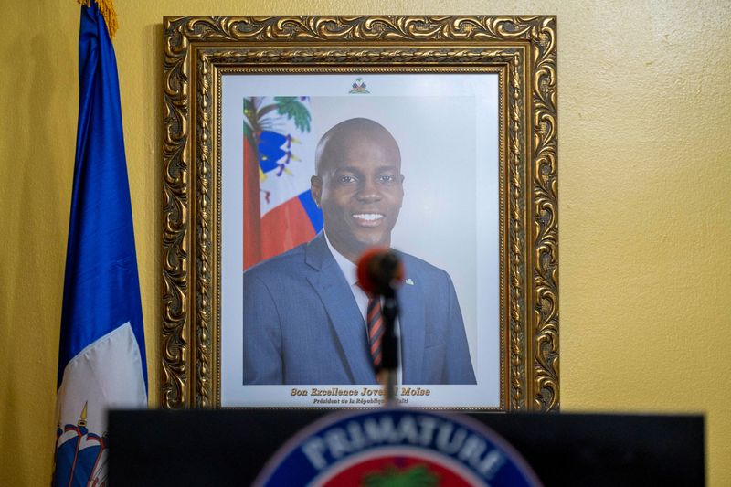 FILE PHOTO: A picture of the late Haitian President Jovenel Moise hangs on a wall before a news conference