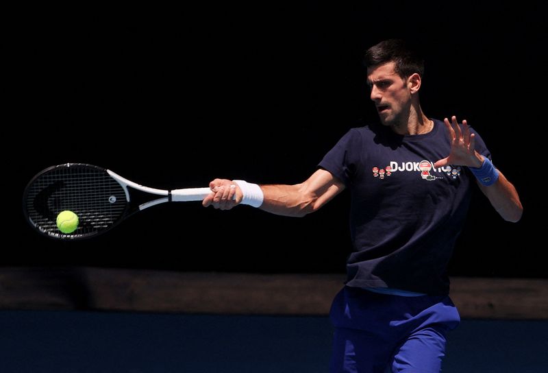 Serbian tennis player Novak Djokovic practices at Melbourne Park as questions remain over the legal battle regarding his visa to play in the Australian Open