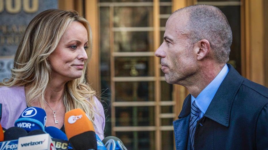 Stormy Daniels, left, stands with her lawyer Michael Avenatti