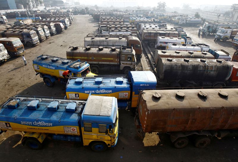 FILE PHOTO: Oil tankers are seen parked at a yard outside a fuel depot on the outskirts of Kolkata