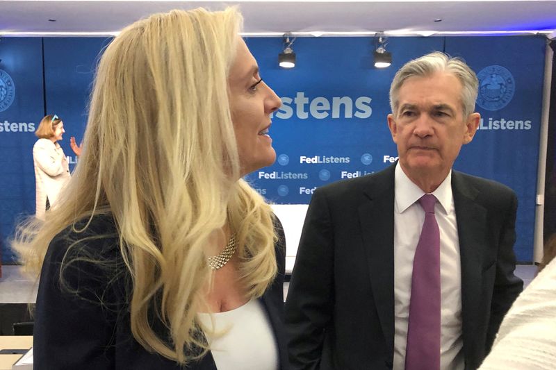 FILE PHOTO: Federal Reserve Chair Jerome Powell speaks with Fed Governor Lael Brainard at the Federal Reserve Bank of Chicago