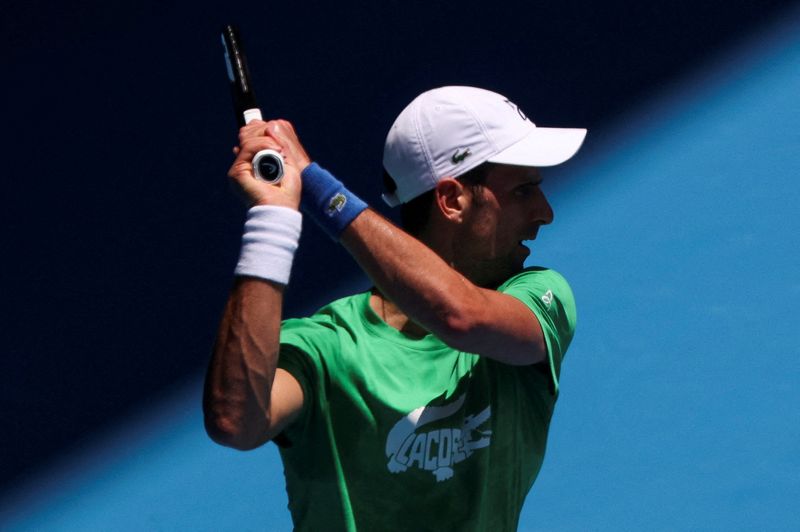 Serbian tennis player Novak Djokovic practices at Melbourne Park as questions remain over the legal battle regarding his visa to play in the Australian Open