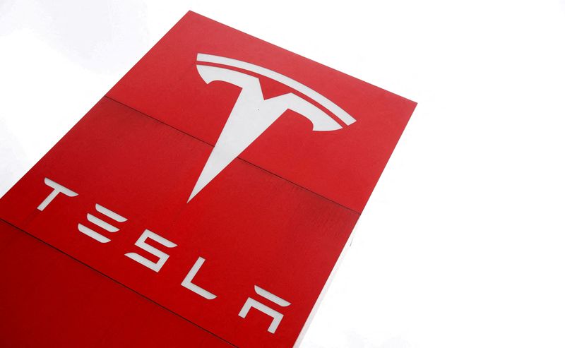 FILE PHOTO: The logo of car manufacturer Tesla is seen at a dealership in London