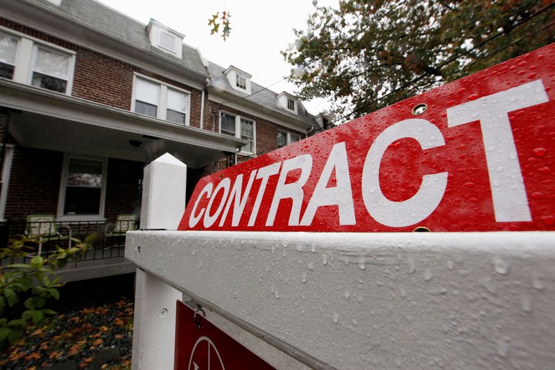 FILE PHOTO: A home with a sign indicating that it is under contract to be sold is seen in a neighborhood of downtown Washington