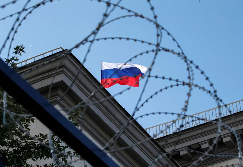 FILE PHOTO: A Russian national flag is seen at the roof of Russian embassy in Kiev