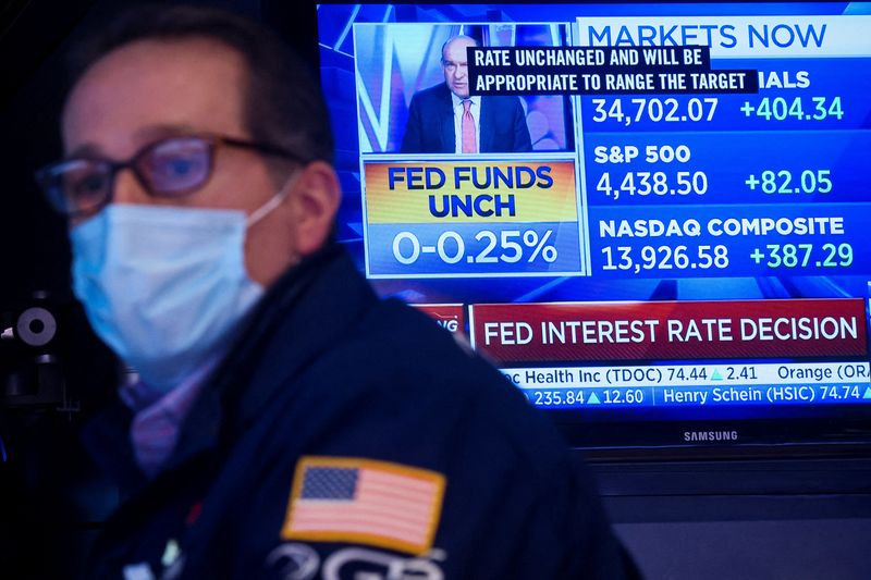 Traders work on the floor of the NYSE in New York