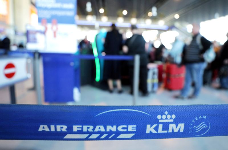 FILE PHOTO: Passengers wait at the Air France desk at Nice international airport