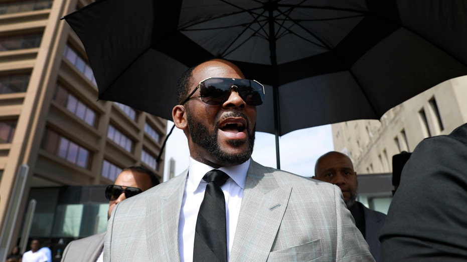 FILE - In this June 6, 2019 file photo, musician R. Kelly departs the Leighton Criminal Court building after pleading not guilty to 11 additional sex-related charges in Chicago. A U.S. Attorneys office spokesman says Kelly was arrested Thursday night, July 11 on federal sex-crime charges in Chicago. (AP Photo/Amr Alfiky, File)