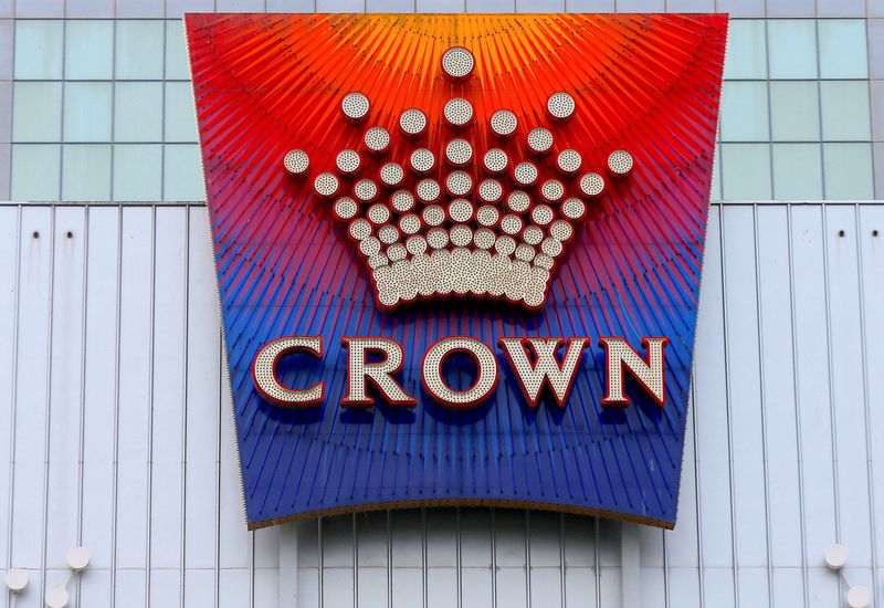 FILE PHOTO: The logo of Australian casino giant Crown Resorts Ltd adorns the hotel and casino complex in Melbourne, Australia