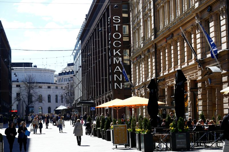 FILE PHOTO: People walk past Stockmann shopping center in Helsinki