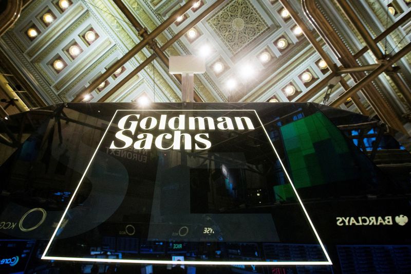 FILE PHOTO: Goldman Sachs sign is seen above floor of the New York Stock Exchange shortly after the opening bell in the Manhattan borough of New York
