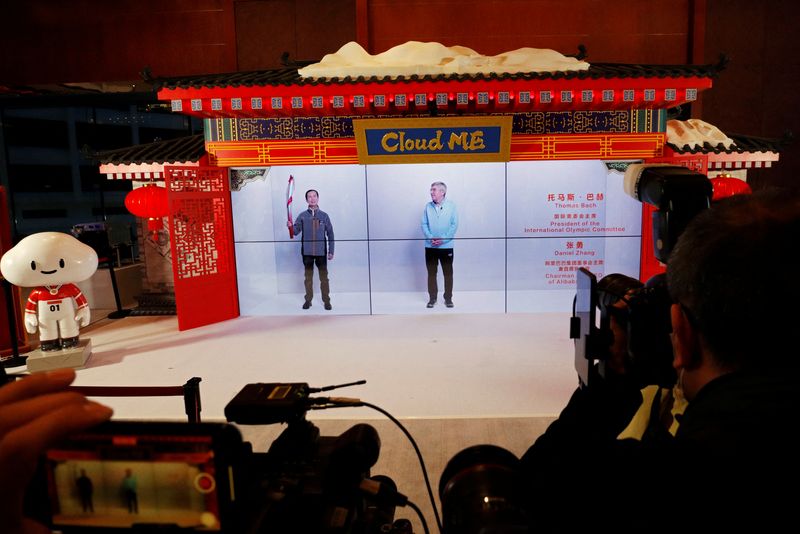 IOC President Thomas Bach and Alibaba Chief Executive Daniel Zhang meet via hologram technology, in Beijing