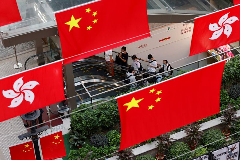 Chinese and Hong Kong flags are pictured outside a mall in Hong Kong