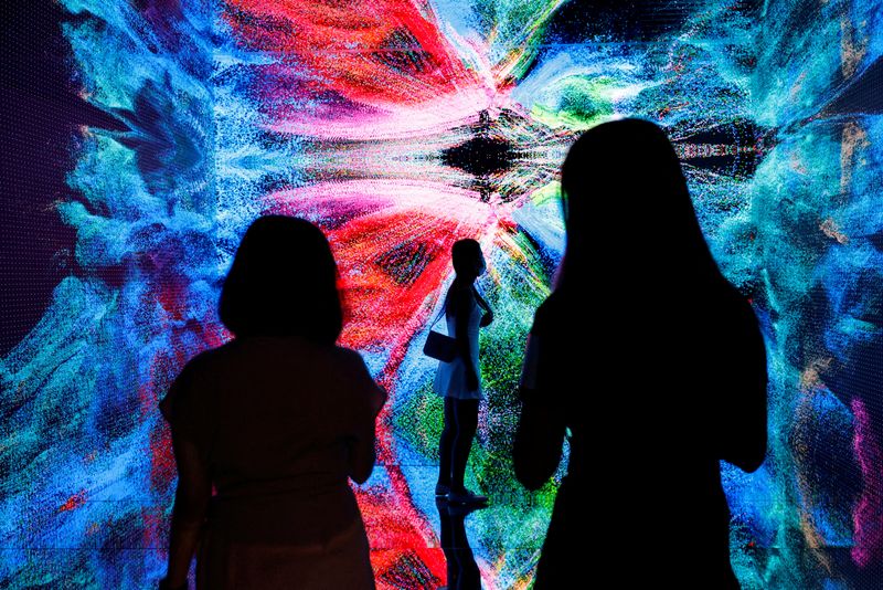 FILE PHOTO: Visitors are pictured in front of an immersive art installation titled 